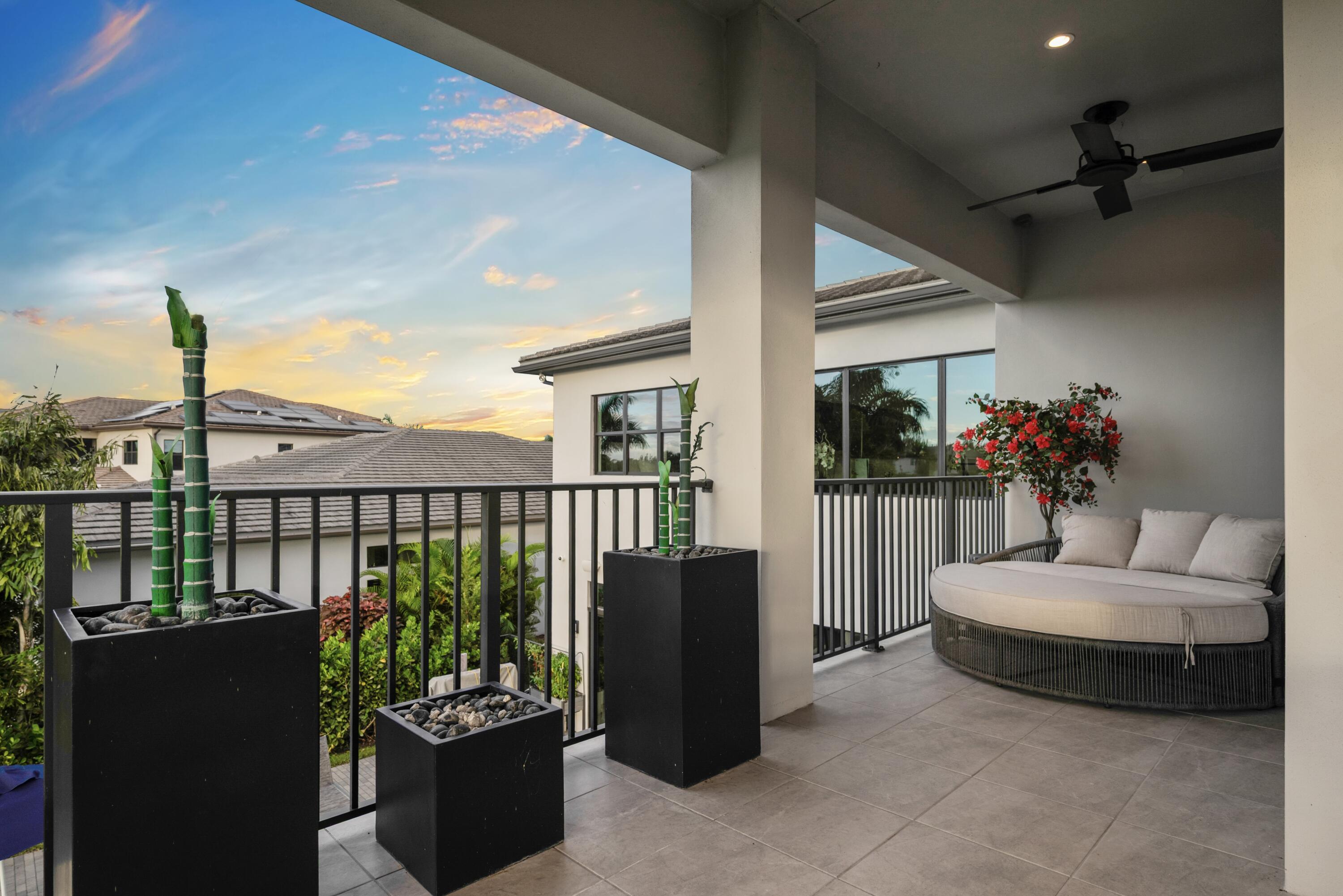 9771 Chianti Classico Terrace Boca Raton, FL 33496 - Photo 96 of 114 a balcony with furniture and a potted plant
