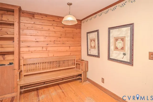 a view of wooden floor and windows in a room