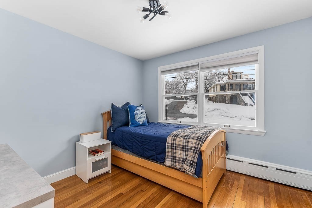 18 Greensboro Road Dedham, MA 02026 - Photo 21 of 39 a bed room with a bed and a window