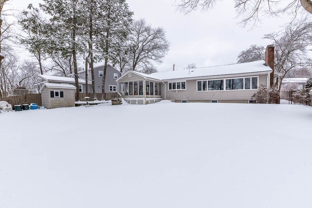 18 Greensboro Road Dedham, MA 02026 - Photo 38 of 39 a view of a building with a large trees