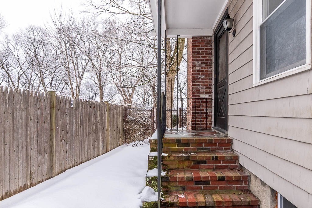 18 Greensboro Road Dedham, MA 02026 - Photo 4 of 39 a view of balcony with wooden floor and fence