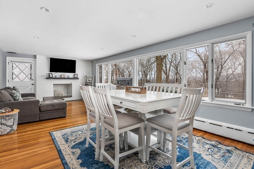 18 Greensboro Road Dedham, MA 02026 - Photo 6 of 39 a view of a dining room with furniture window and wooden floor