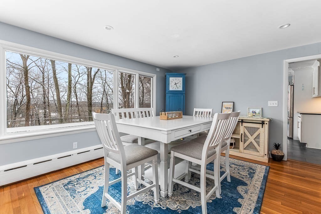 18 Greensboro Road Dedham, MA 02026 - Photo 10 of 39 a view of a dining room with furniture window and wooden floor