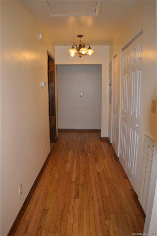 116 Cove Road Rutherfordton, NC 28139 - Photo 7 of 16 a view of a room with wooden floor a ceiling fan