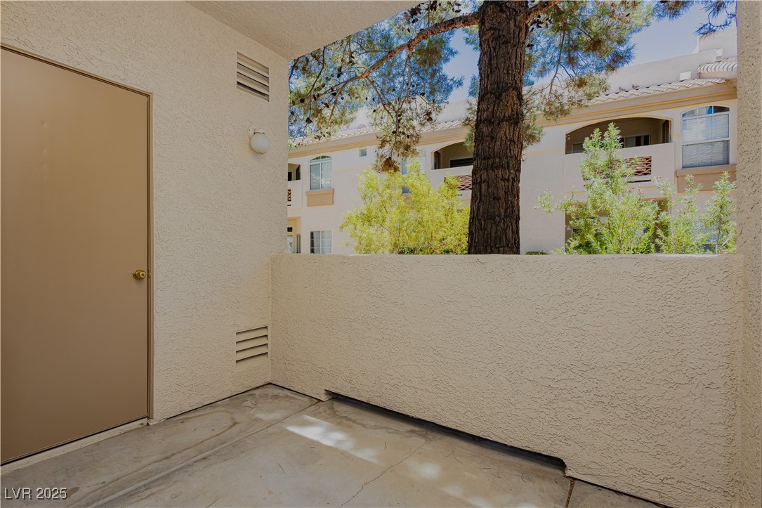 7400 West Flamingo Road, Unit 1033 Las Vegas, NV 89147 - Photo 22 of 29 Covered patio with entrance from Primary Suite and Living Room