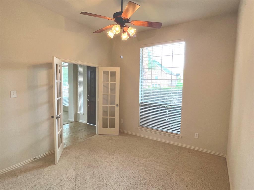 4101 White Porch Road Plano, TX 75024 - Photo 9 of 18 Room featuring light neutral-toned walls, plush carpeting, and a ceiling fan with integrated lighting