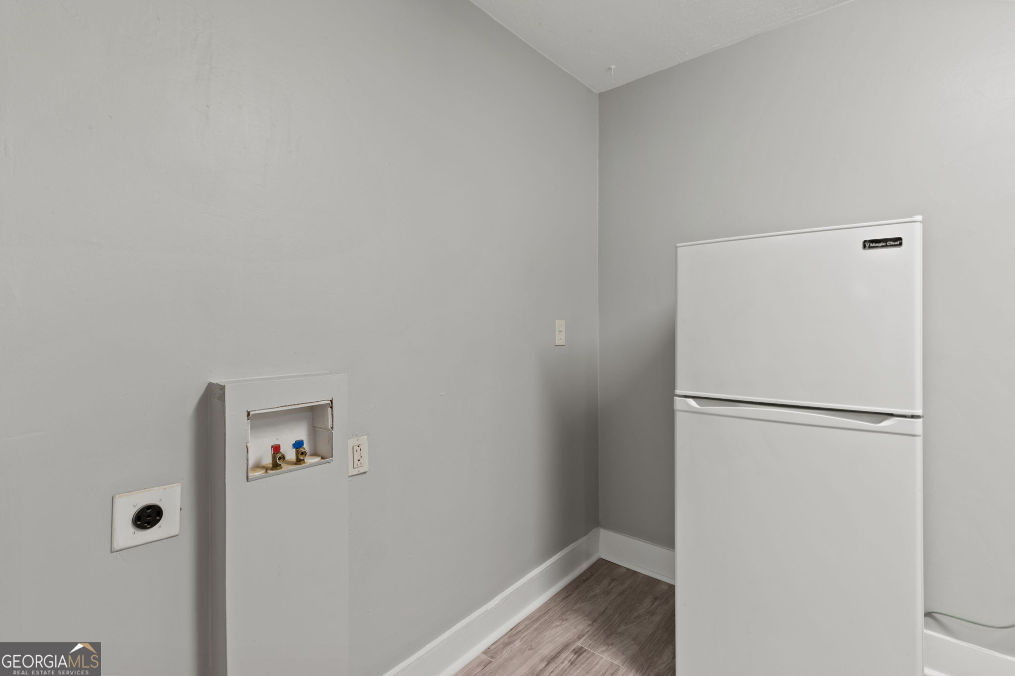 181 Holderness Street Southwest Atlanta, GA 30314 - Photo 14 of 18 A washer / dryer has been added to this space.