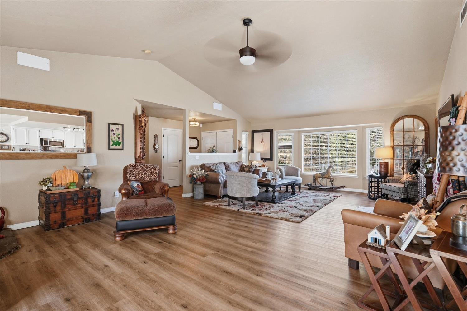 32583 River Knolls Road Coarsegold, CA 93614 - Photo 11 of 63 a living room with furniture and a large window
