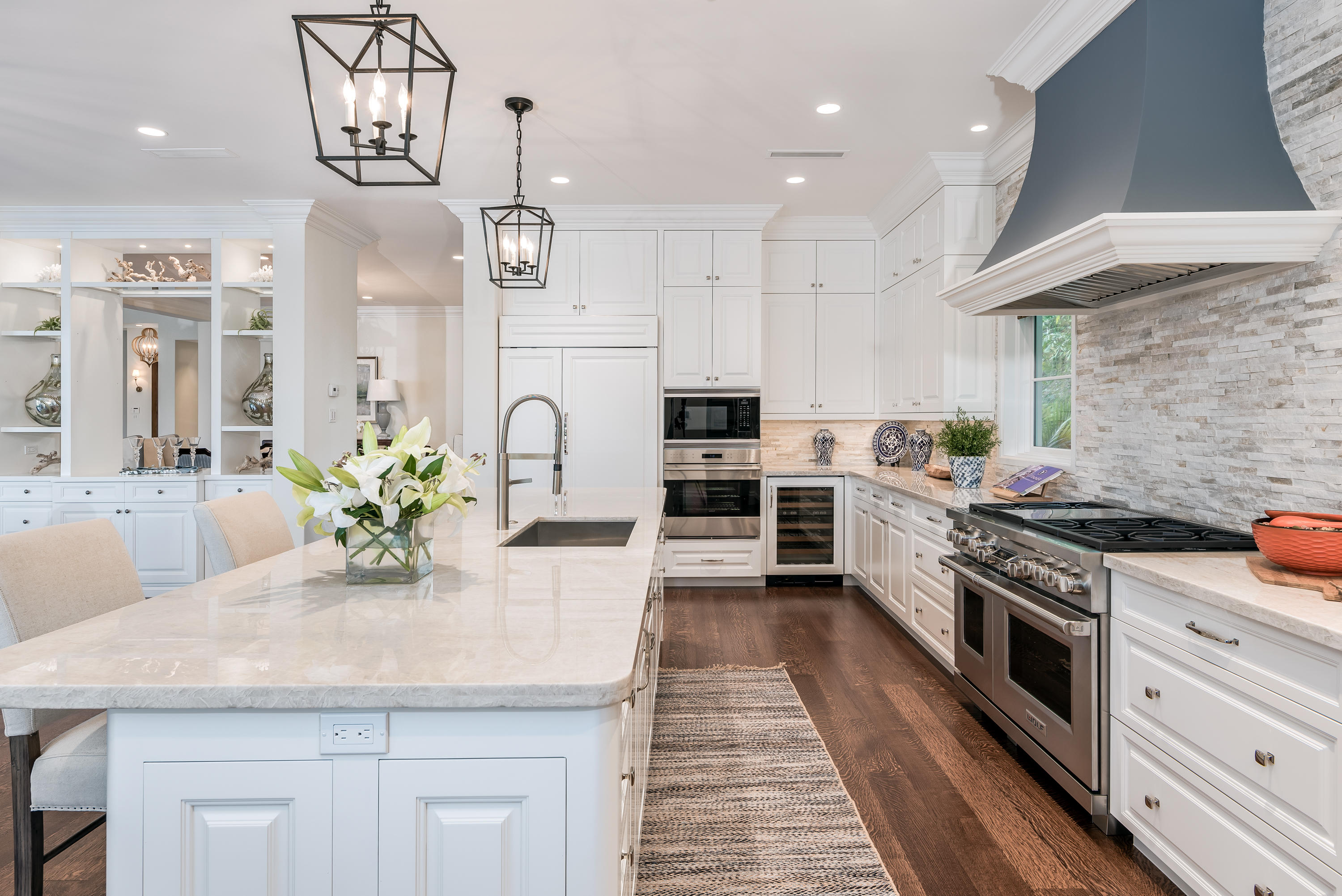 651 Northeast 45th Road Boca Raton, FL 33431 - Photo 6 of 23 a kitchen with stainless steel appliances kitchen island granite countertop a stove a sink and a refrigerator