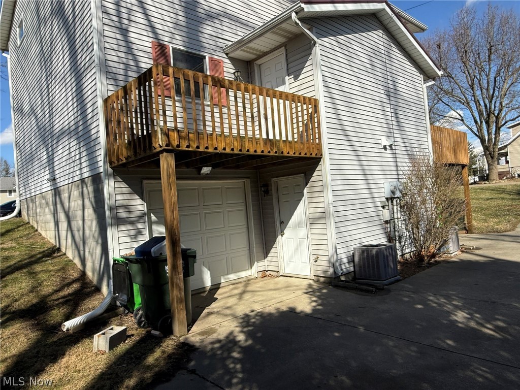 604 Harger Street Dover, OH 44622 - Photo 23 of 25 Back of property featuring concrete driveway and an attached garage