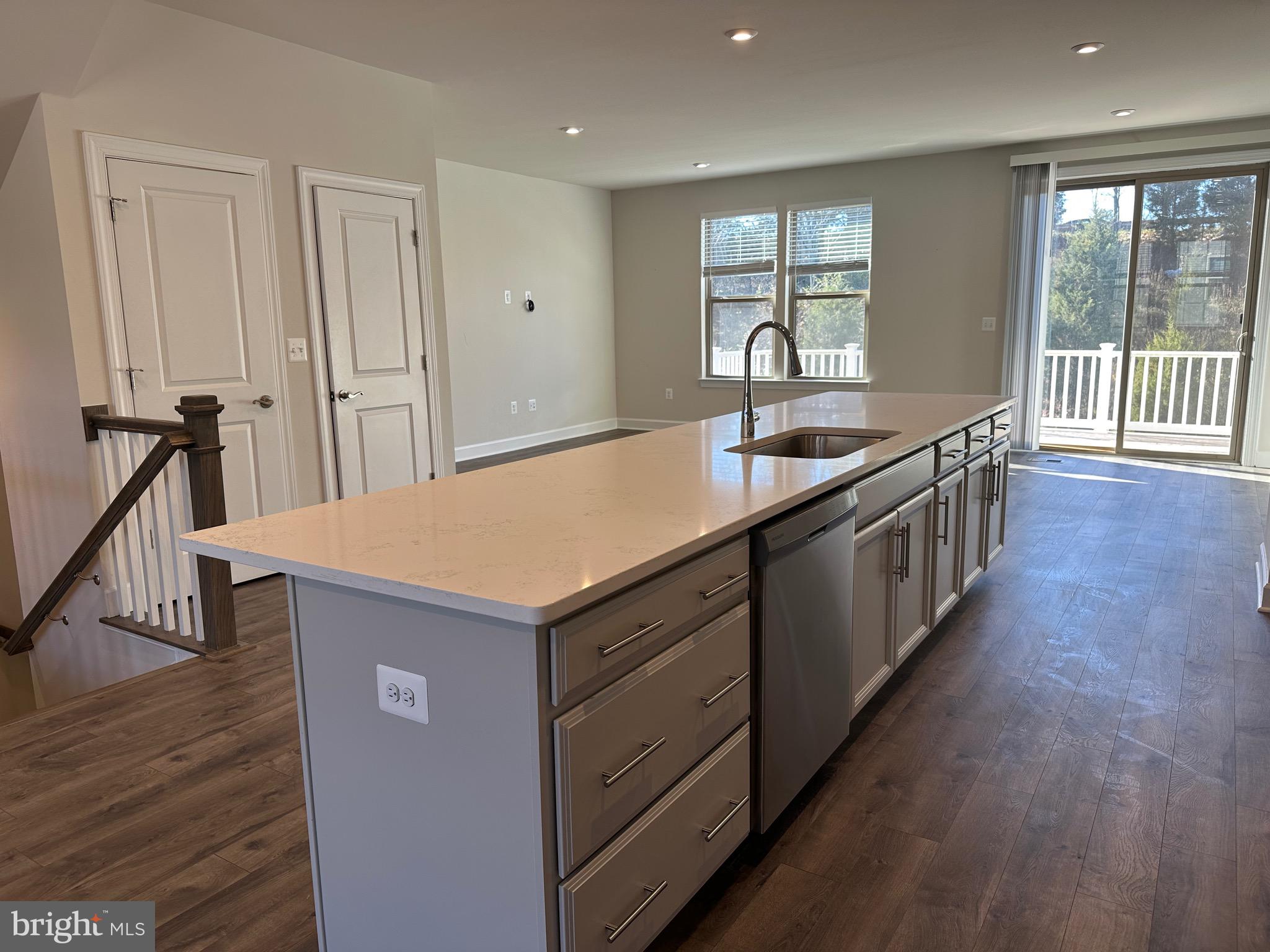 9886 Hopkins Loop Manassas, VA 20110 - Photo 13 of 50 a kitchen with a sink and wooden floor