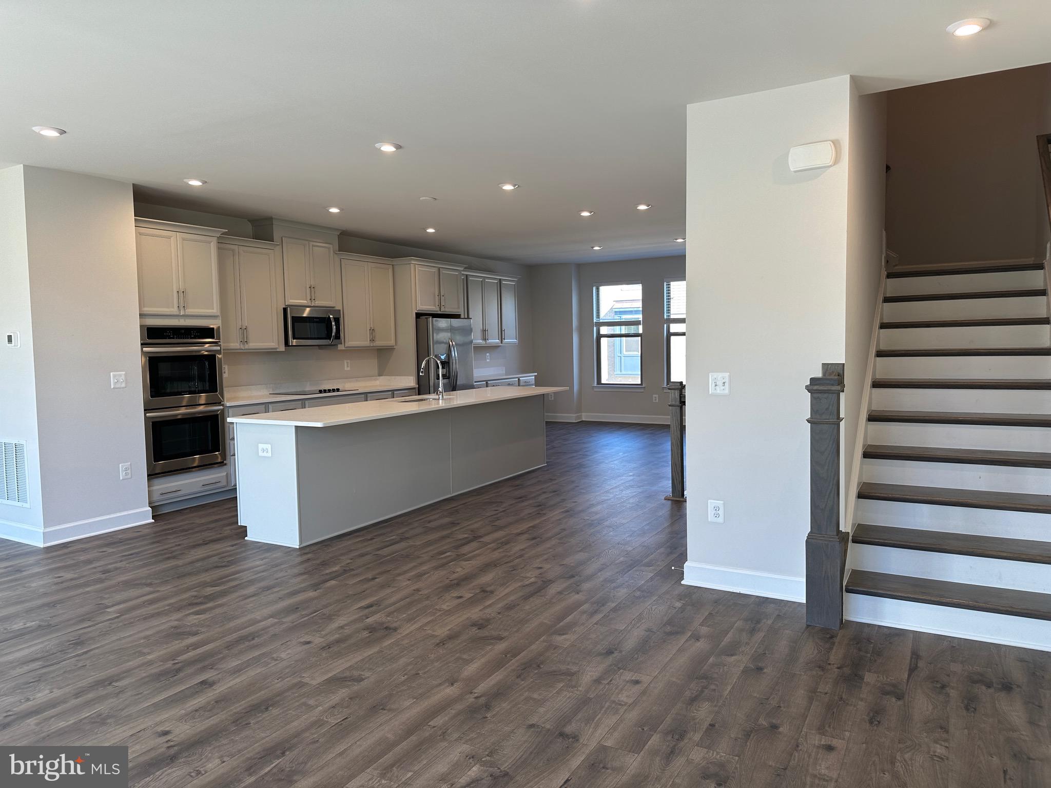 9886 Hopkins Loop Manassas, VA 20110 - Photo 24 of 50 a view of kitchen with wooden floor and electronic appliances