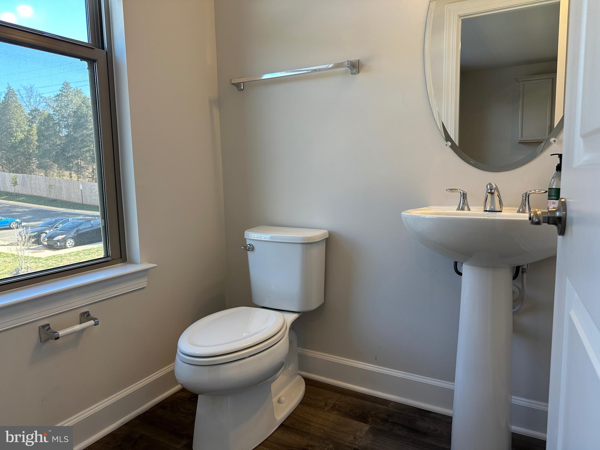 9886 Hopkins Loop Manassas, VA 20110 - Photo 25 of 50 a bathroom with a toilet sink and mirror