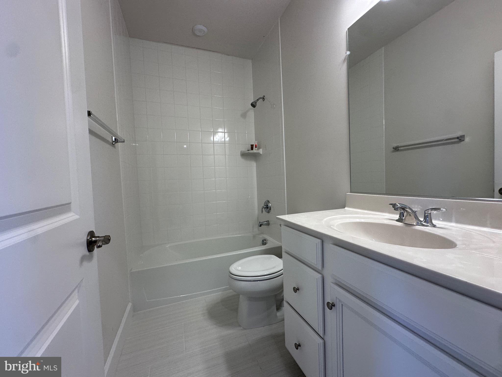 9886 Hopkins Loop Manassas, VA 20110 - Photo 27 of 50 a bathroom with a sink a toilet and shower