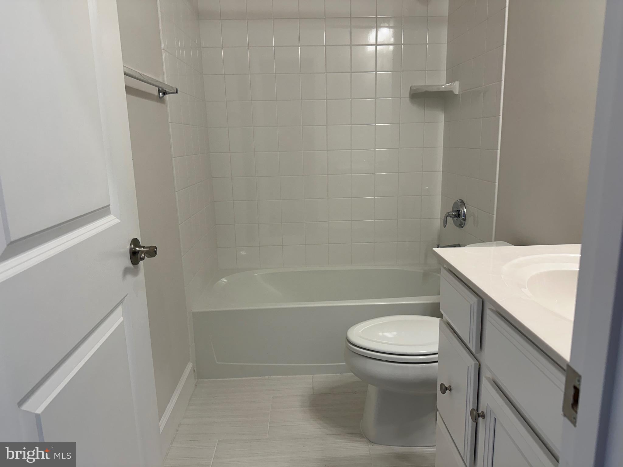 9886 Hopkins Loop Manassas, VA 20110 - Photo 43 of 50 a white toilet sitting next to a bath tub