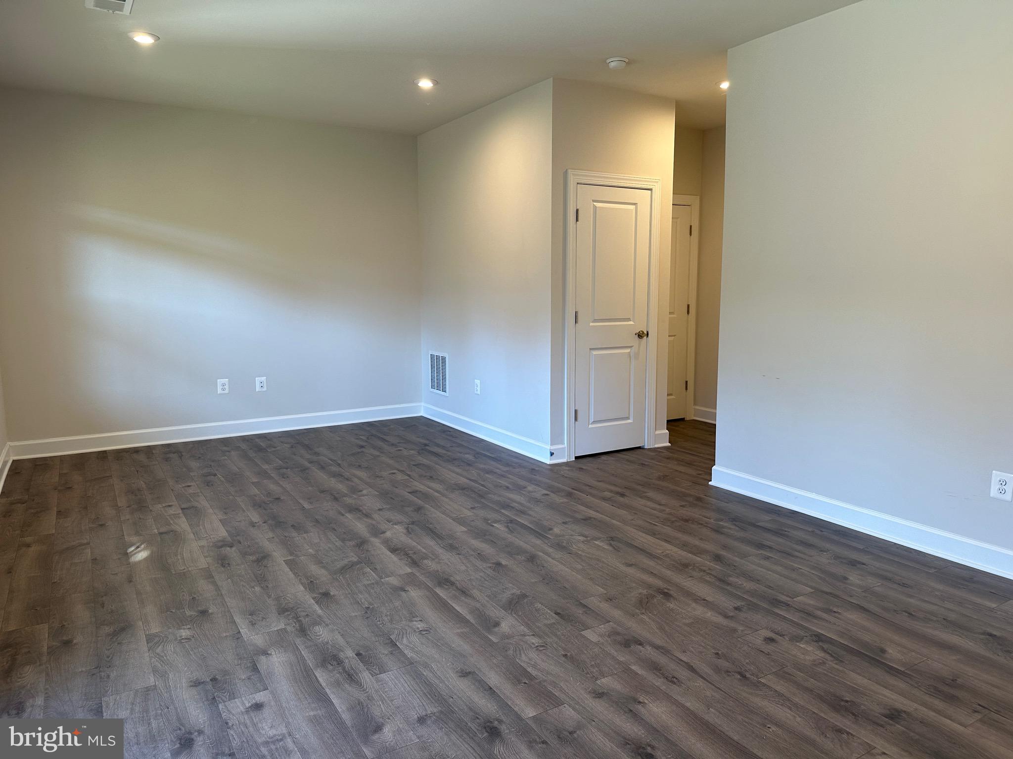 9886 Hopkins Loop Manassas, VA 20110 - Photo 44 of 50 an empty room with wooden floor and windows
