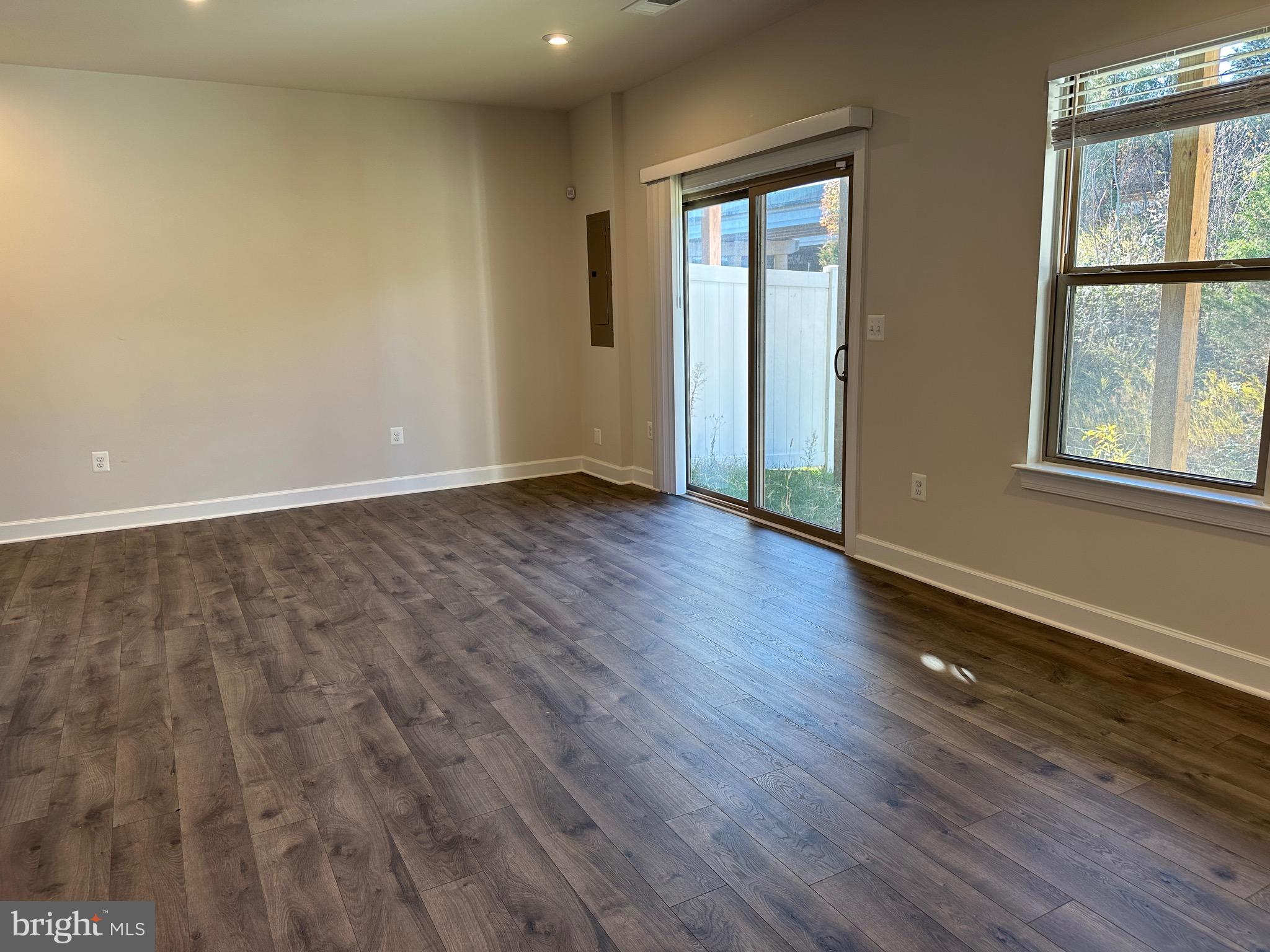 9886 Hopkins Loop Manassas, VA 20110 - Photo 46 of 50 an empty room with wooden floor and windows