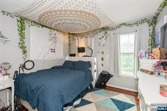 a room with furniture and a flat screen tv