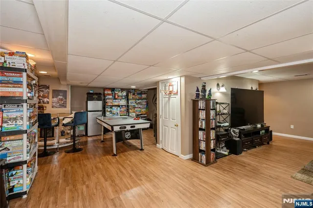 a room with lots of furniture and wooden floor