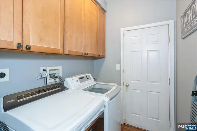 a view of deck with furniture and barbeque oven a wooden floor