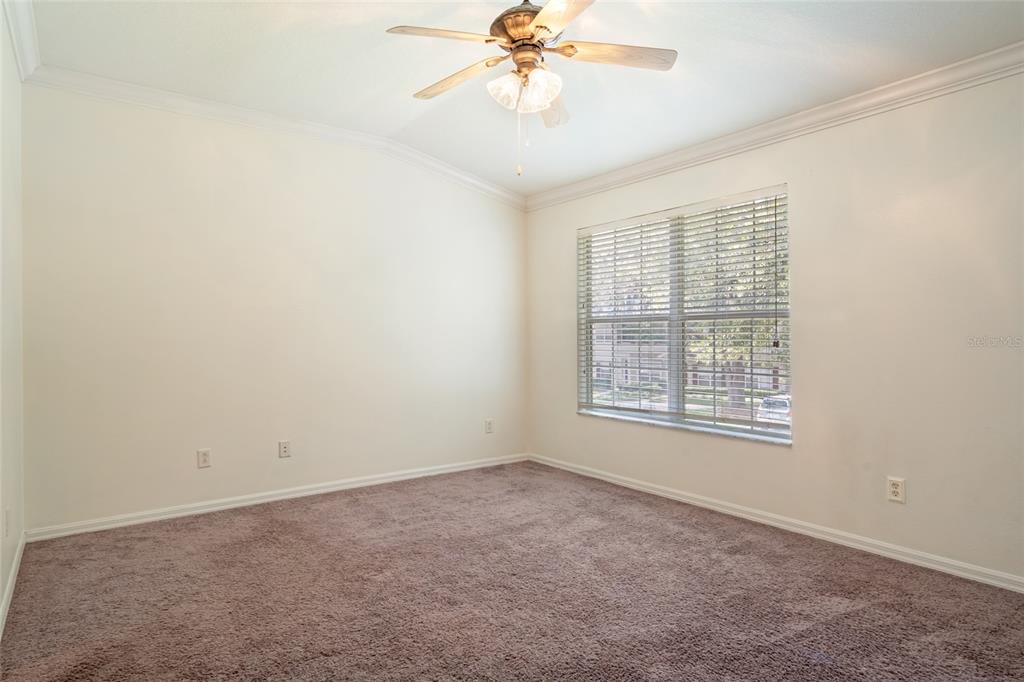 15929 Fishhawk Creek Lane Lithia, FL 33547 - Photo 14 of 25 an empty room with a window and a fan