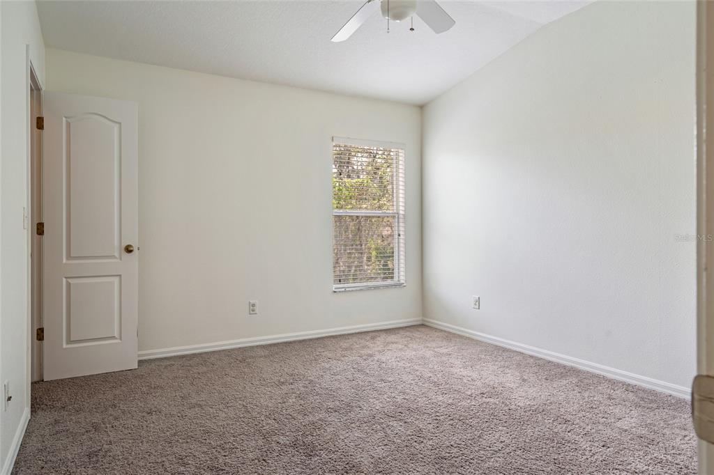 15929 Fishhawk Creek Lane Lithia, FL 33547 - Photo 20 of 25 an empty room with windows