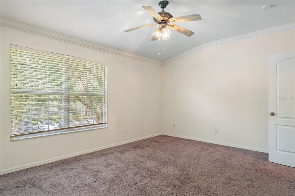 15929 Fishhawk Creek Lane Lithia, FL 33547 - Photo 24 of 25 an empty room with a window and a fan