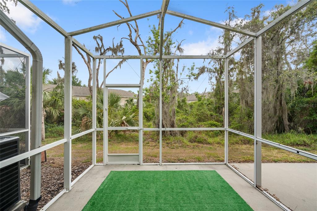 15929 Fishhawk Creek Lane Lithia, FL 33547 - Photo 3 of 25 a view of a house with a big yard and a large window with garden view