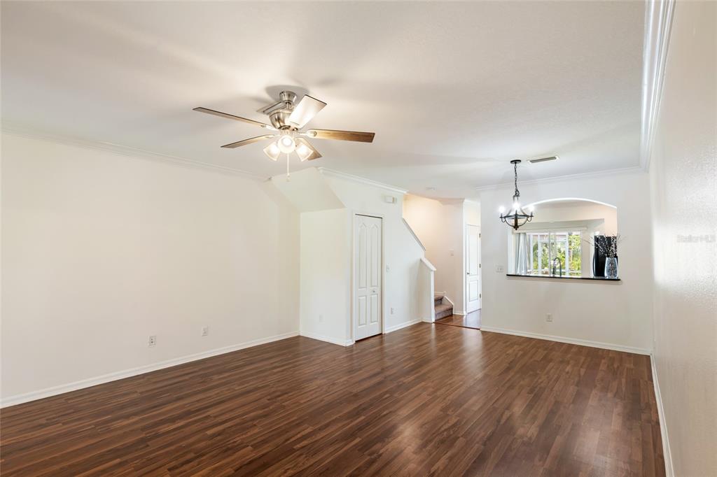 15929 Fishhawk Creek Lane Lithia, FL 33547 - Photo 10 of 25 a view of an empty room with window and wooden floor