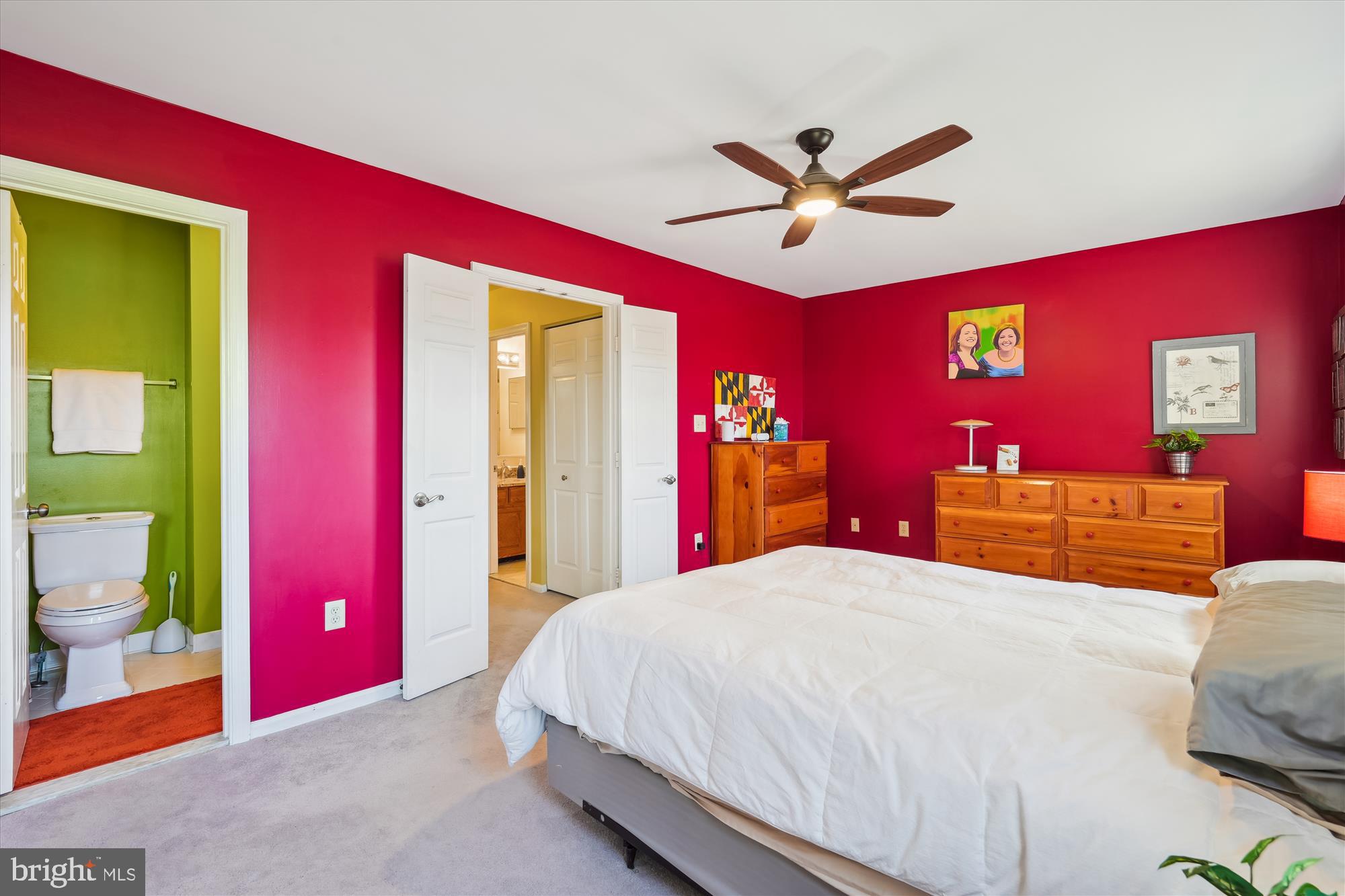 2917 Gracefield Road Silver Spring, MD 20904 - Photo 27 of 51 a bedroom with a bed and a chandelier