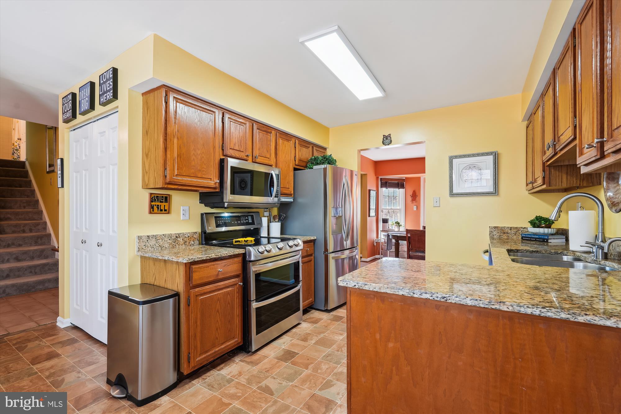 2917 Gracefield Road Silver Spring, MD 20904 - Photo 5 of 51 a kitchen with stainless steel appliances granite countertop a stove a sink and a refrigerator
