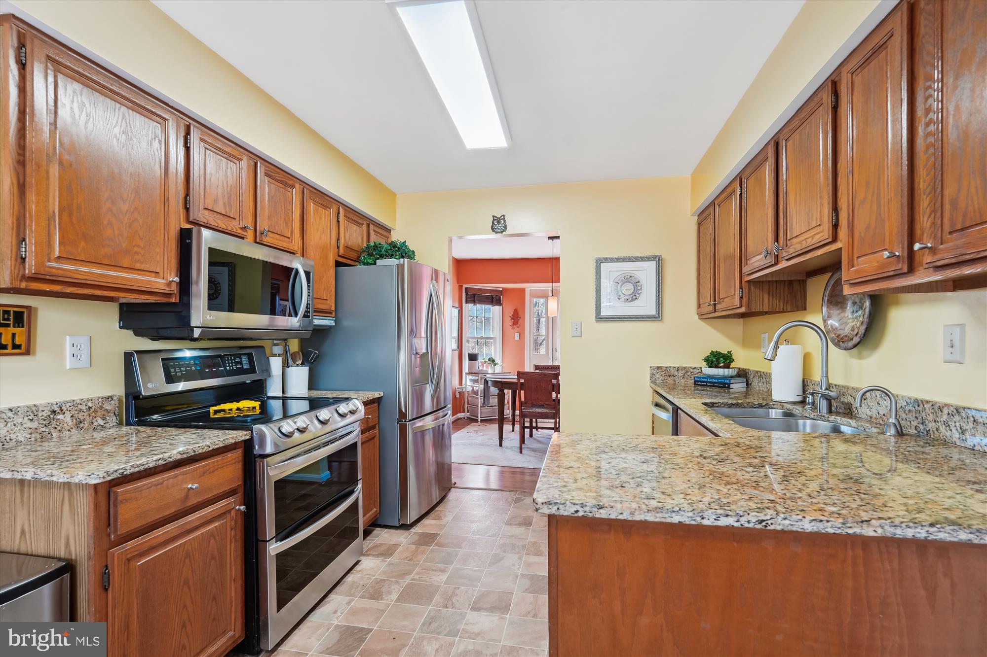 2917 Gracefield Road Silver Spring, MD 20904 - Photo 6 of 51 a kitchen with stainless steel appliances granite countertop a stove a sink and a microwave