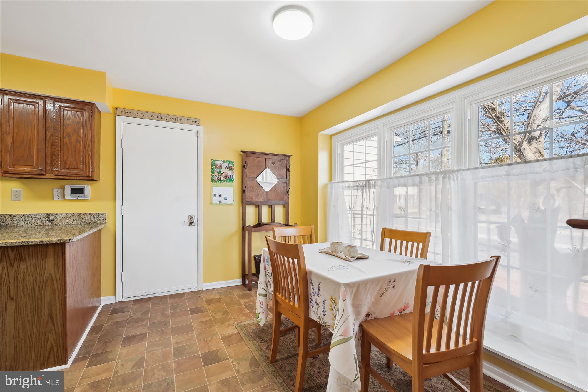 2917 Gracefield Road Silver Spring, MD 20904 - Photo 7 of 51 a view of a kitchen with a dining table and chairs