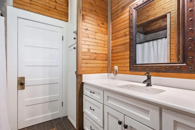a bathroom with a sink and a mirror