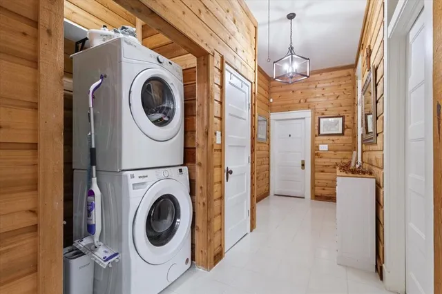a view of a hallway with washer and dryer