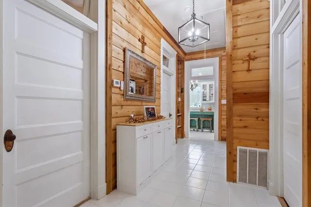 a bathroom with a granite countertop sink a mirror and shower