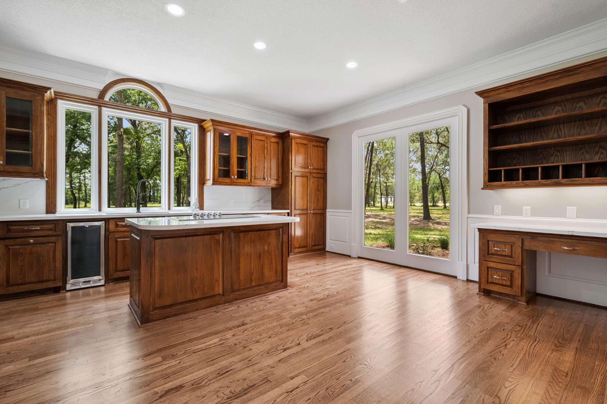 18489 Country Pl Drive Conroe, TX 77302 - Photo 11 of 50 a large living room with a large window and wooden floors