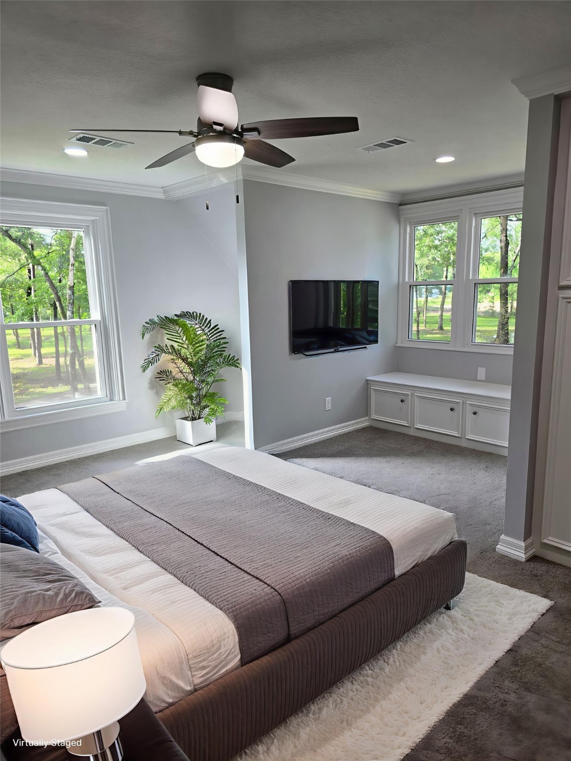 18489 Country Pl Drive Conroe, TX 77302 - Photo 34 of 50 a bedroom with a bed and a flat screen tv