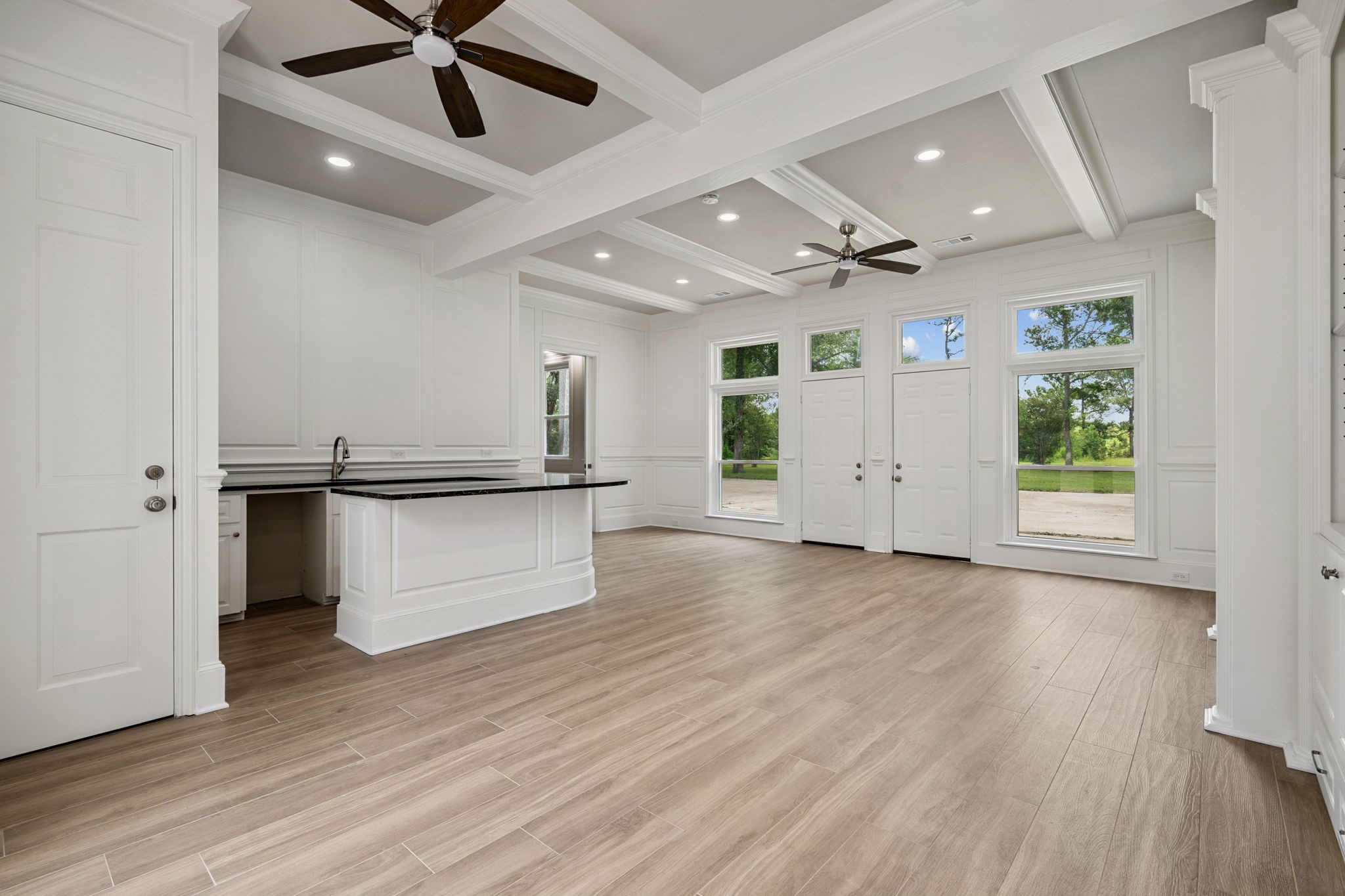 18489 Country Pl Drive Conroe, TX 77302 - Photo 39 of 50 an empty room with wooden floor and windows