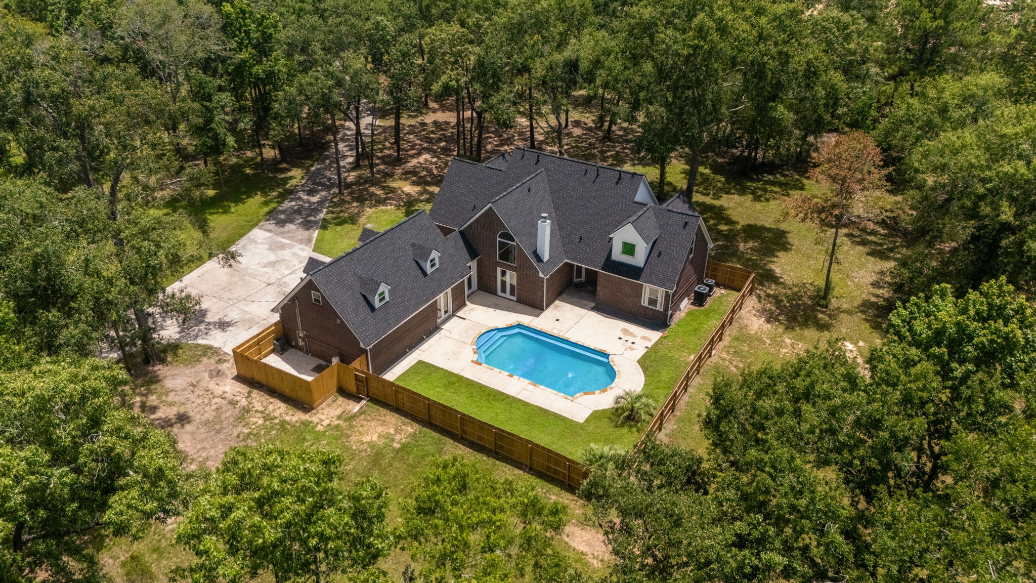 18489 Country Pl Drive Conroe, TX 77302 - Photo 50 of 50 an aerial view of a house with a yard and trees