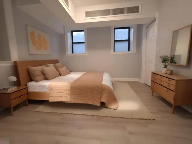 a bedroom with a bed and a couch