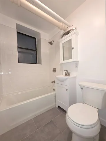 a bathroom with a toilet sink and bathtub