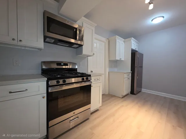 a kitchen with stainless steel appliances granite countertop a stove and a microwave