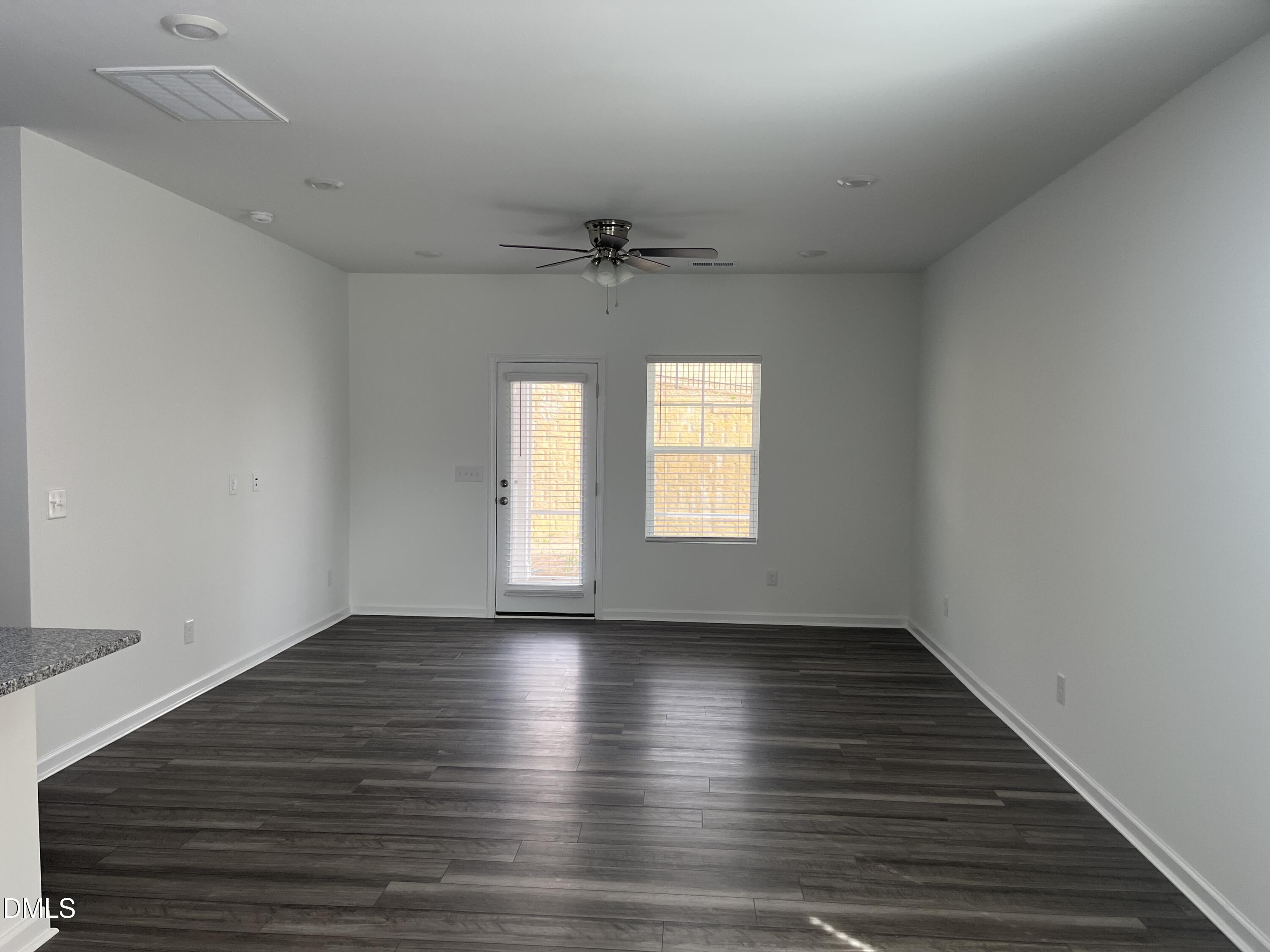 1028 Red Finch Way Angier, NC 27501 - Photo 11 of 50 wooden floor in an empty room with a window