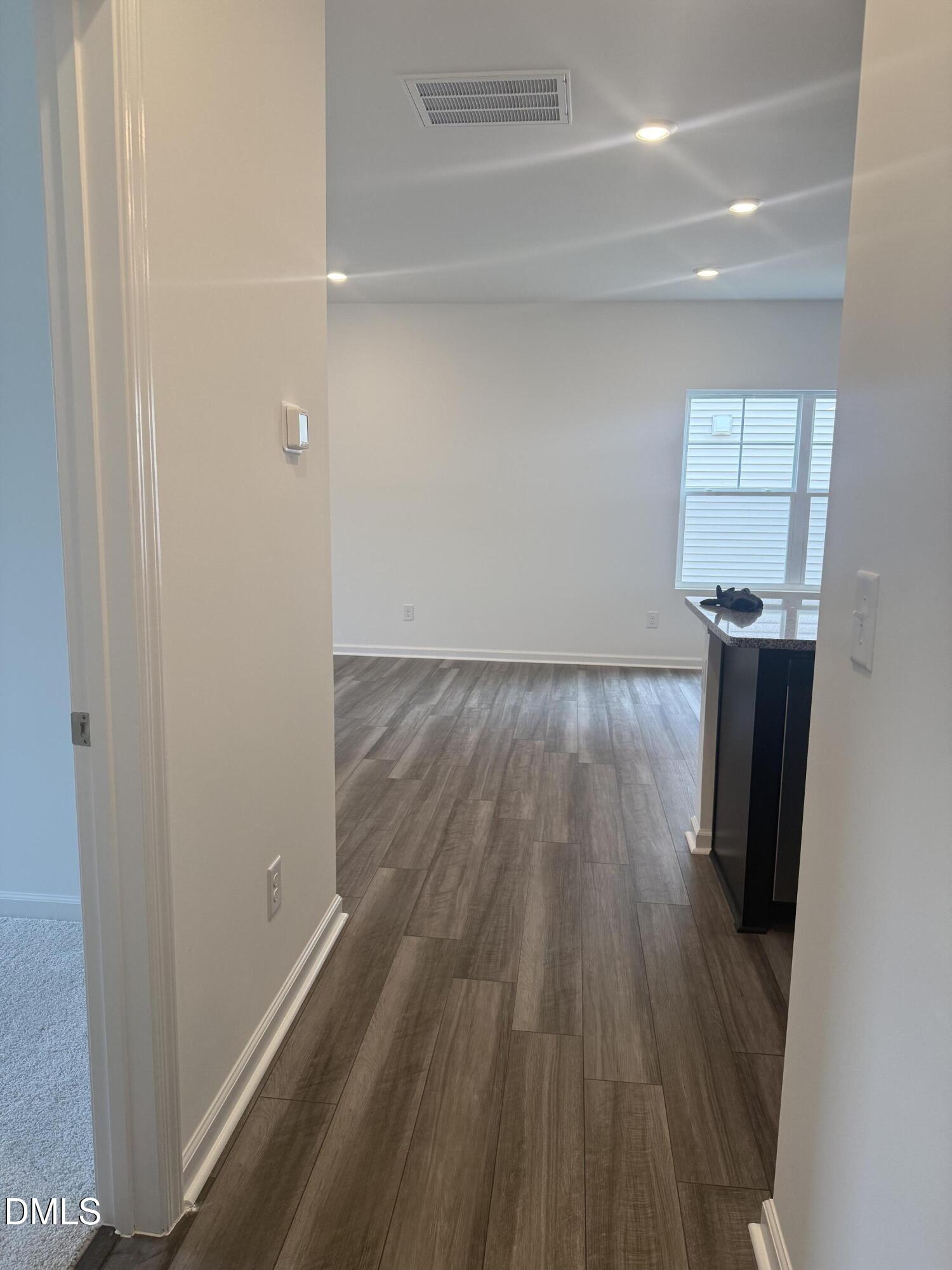 1028 Red Finch Way Angier, NC 27501 - Photo 12 of 50 a view of a room with wooden floor and staircase