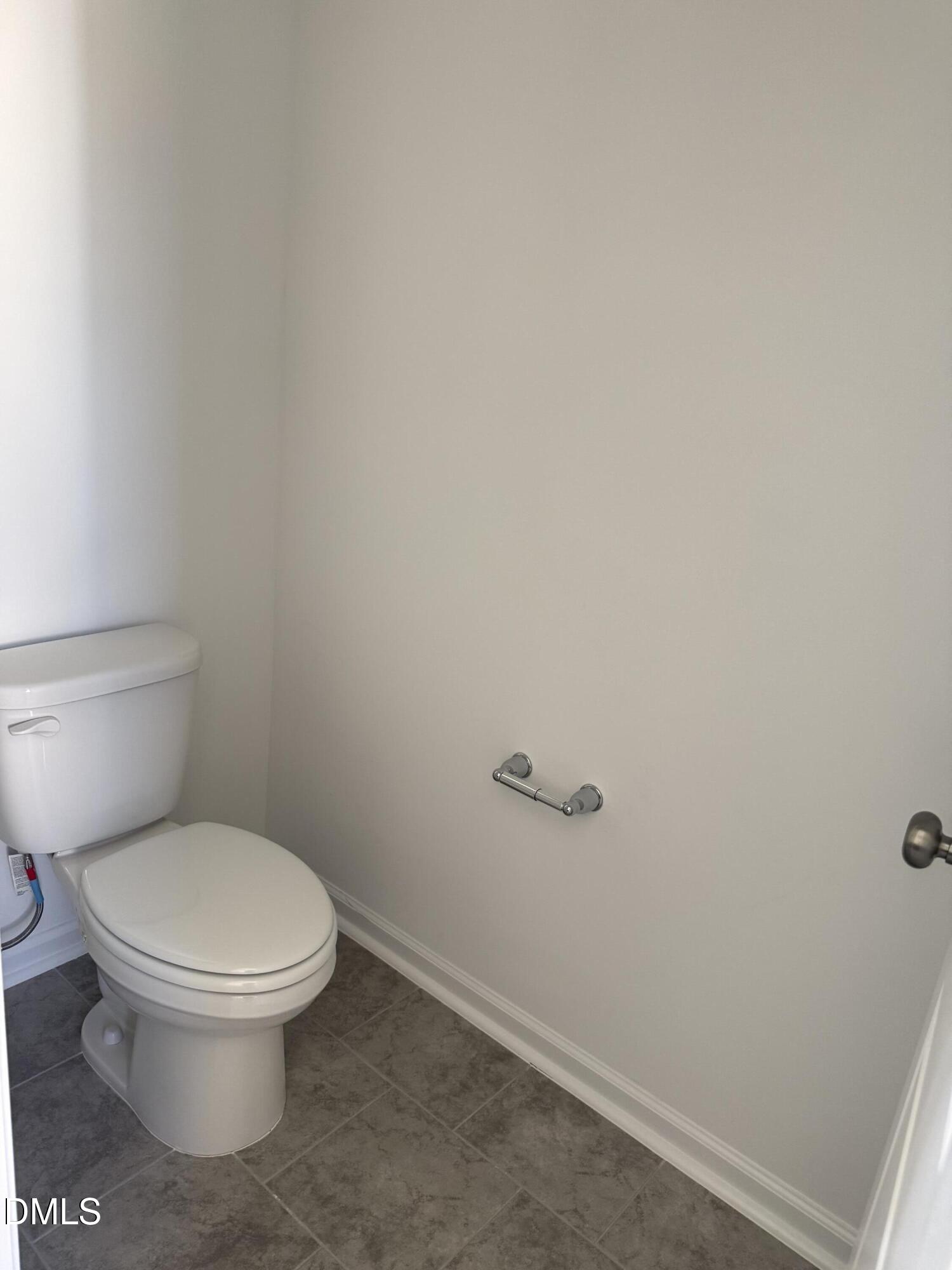 1028 Red Finch Way Angier, NC 27501 - Photo 25 of 50 a white toilet sitting next to a white wall