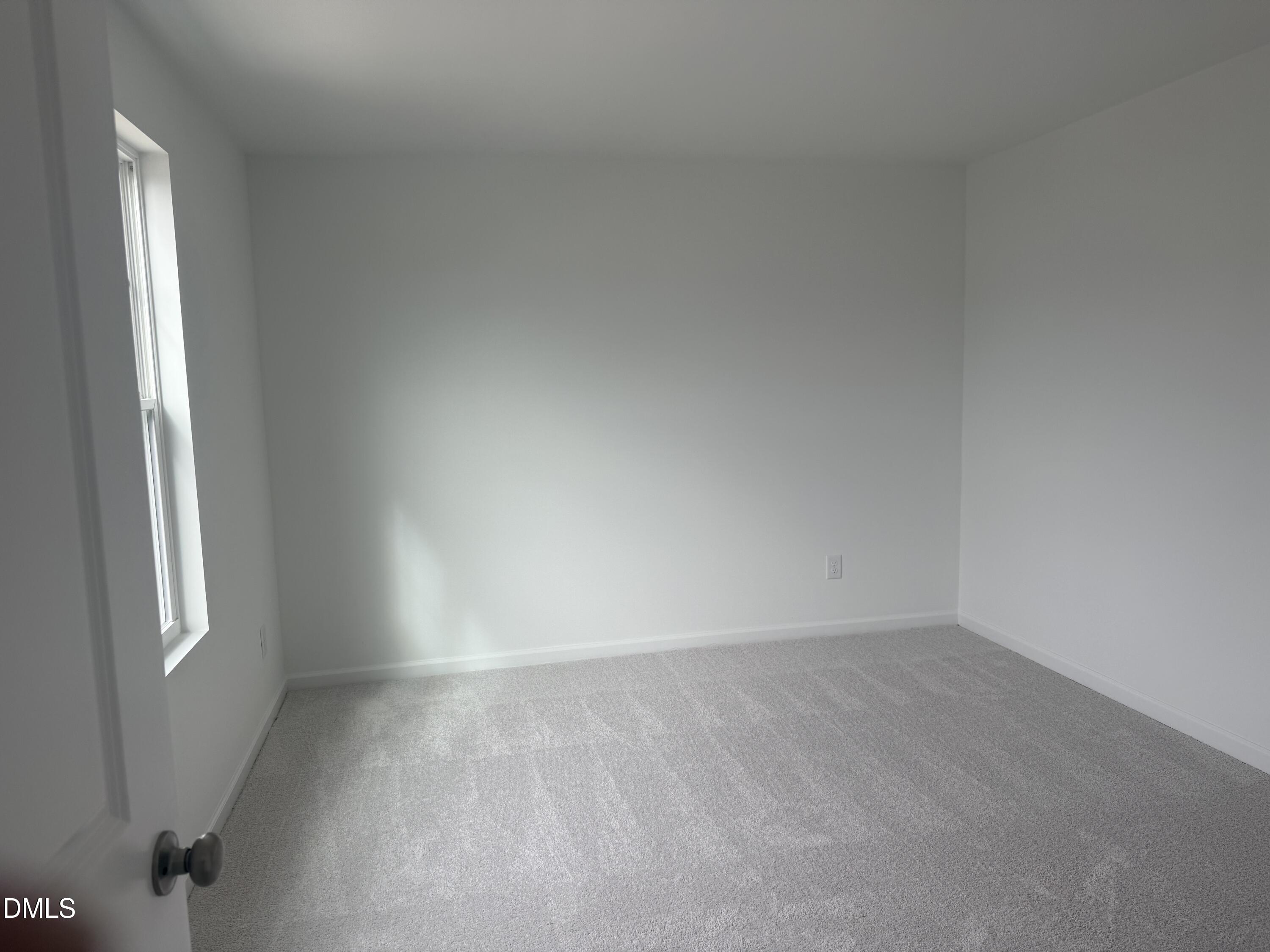 1028 Red Finch Way Angier, NC 27501 - Photo 37 of 50 an empty room with windows