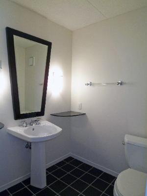 112 Avon Road Northbrook, IL 60062 - Photo 3 of 16 a bathroom with a toilet sink and mirror