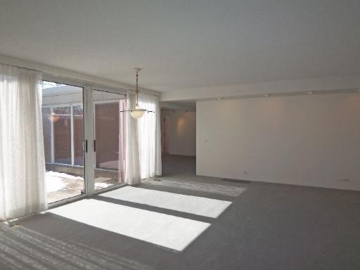 112 Avon Road Northbrook, IL 60062 - Photo 4 of 16 a view of a room with wooden floor and window