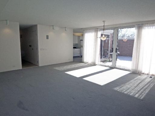112 Avon Road Northbrook, IL 60062 - Photo 5 of 16 a view of a room with a ceiling fan and window